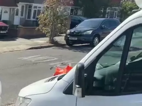 One of the Apex vans on a residential street