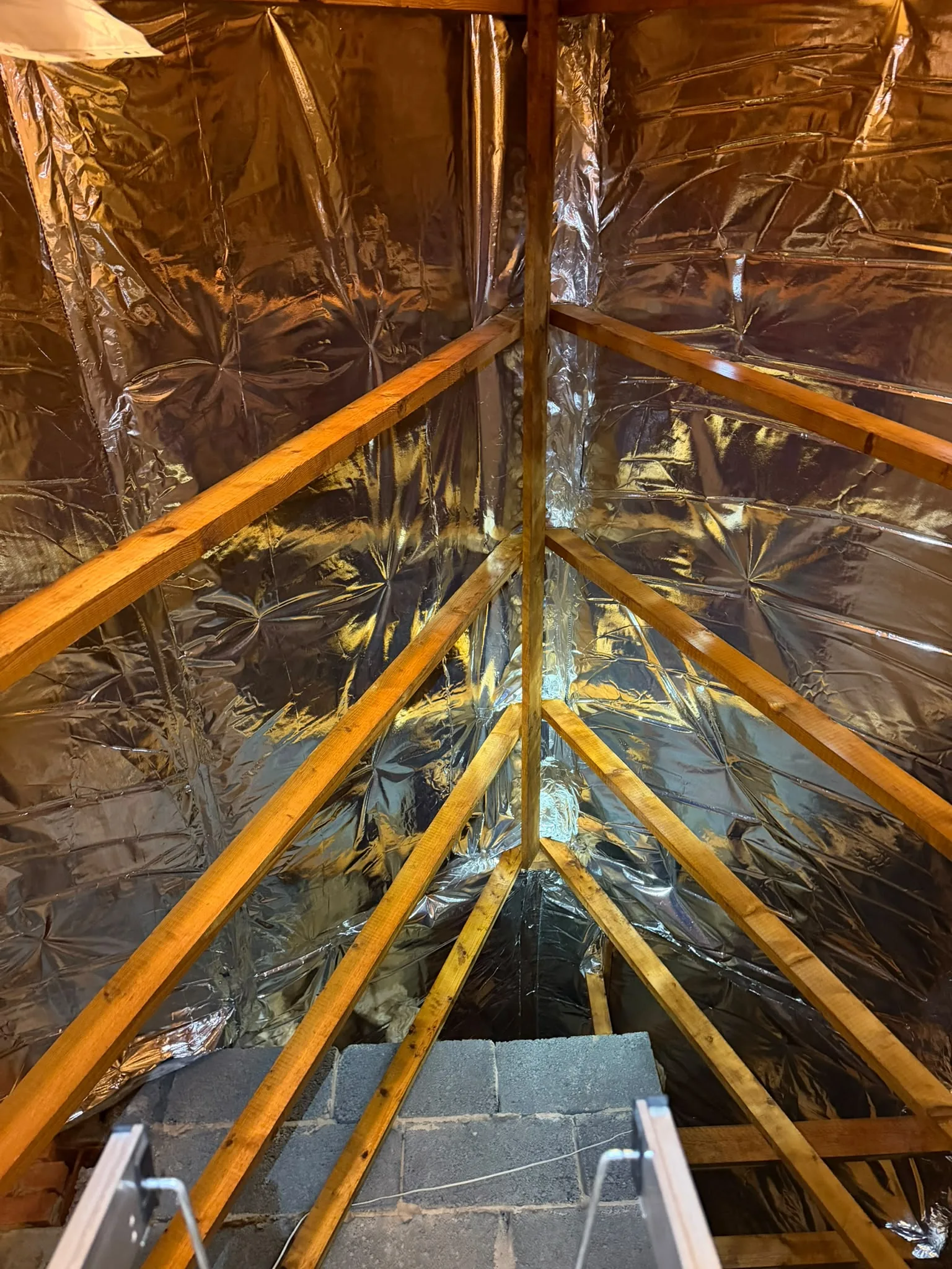 Loft lined with reflective foil insulation up to the apex